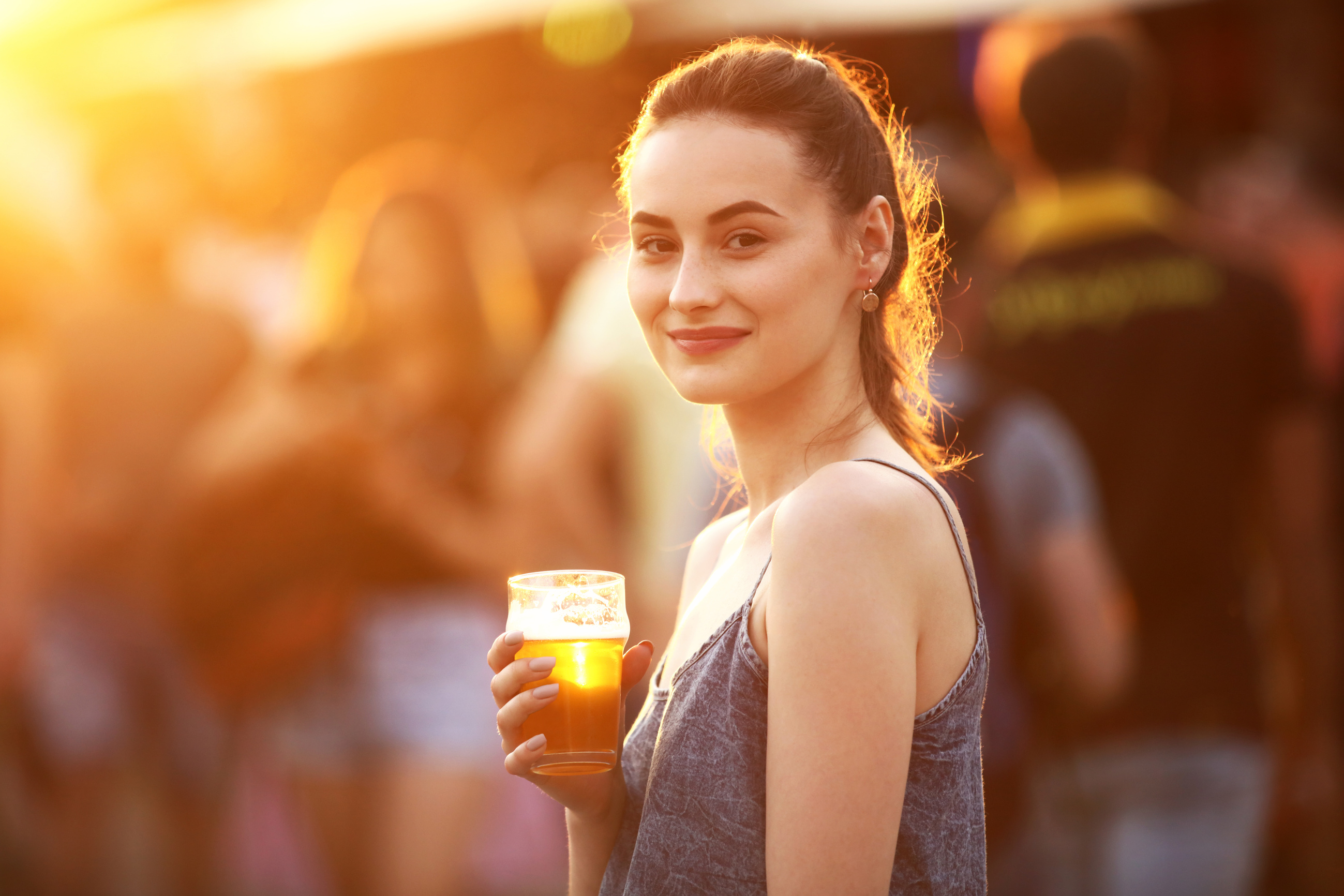 Woman Drinking Beer Outdoors