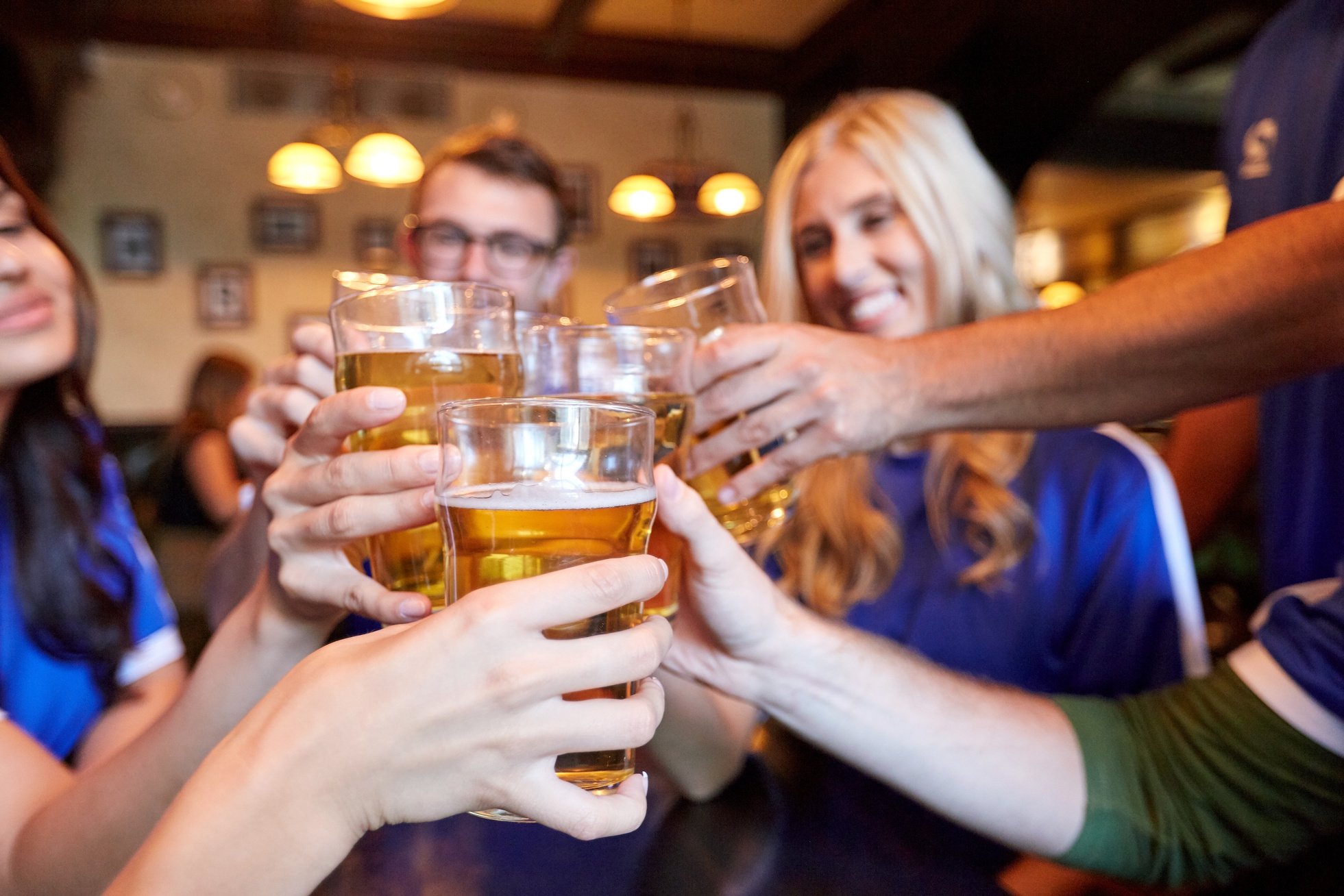 Football Fans Clinking Beer